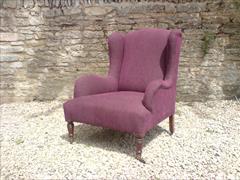Antique low wing chair by Howard and Sons1.jpg